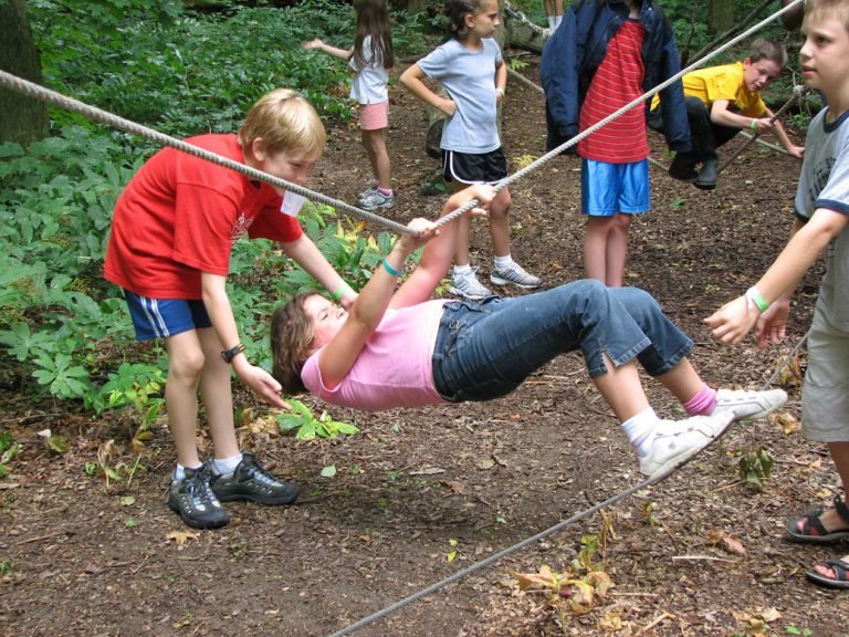 Spotting one another on the low ropes course