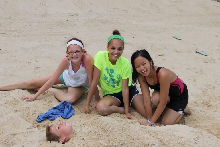 Teens playing in the sand