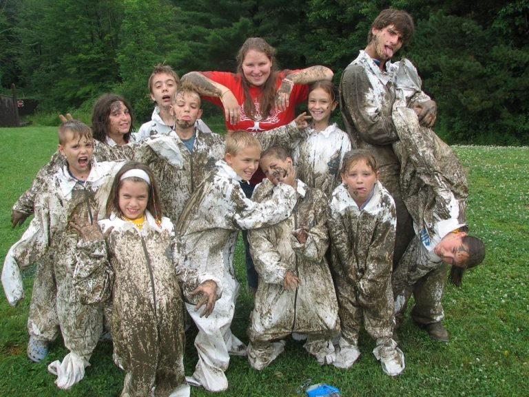 A group of very muddy children