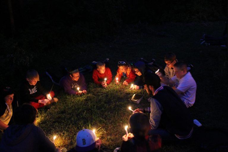 A group of children holding candles